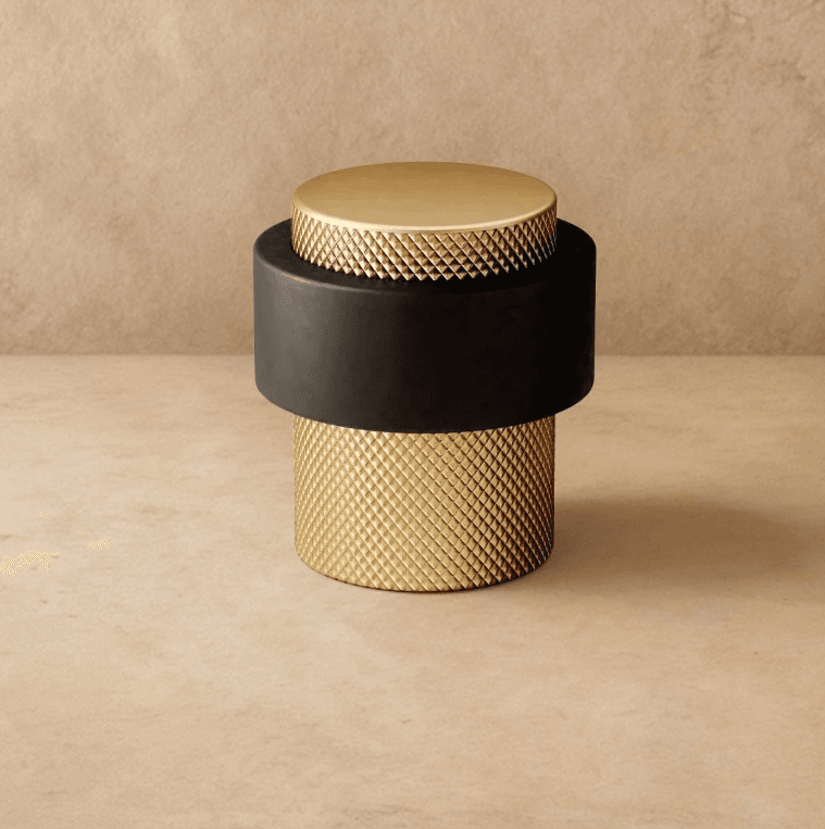 Desist Door Stop Knurled Color: Satin Brass, Dimensions: D1.5" x H1.6", Finish: Brass, Weight: 120g, 1 yr Wrrty